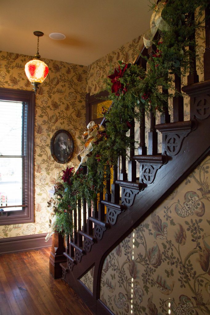 Holiday garland on the staircase railing at the Blind Boone Home
