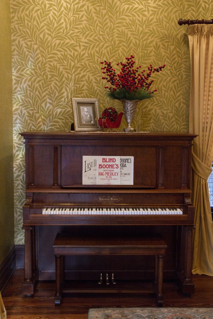Piano displaying Blind Boone sheet music at the Blind Boone Home